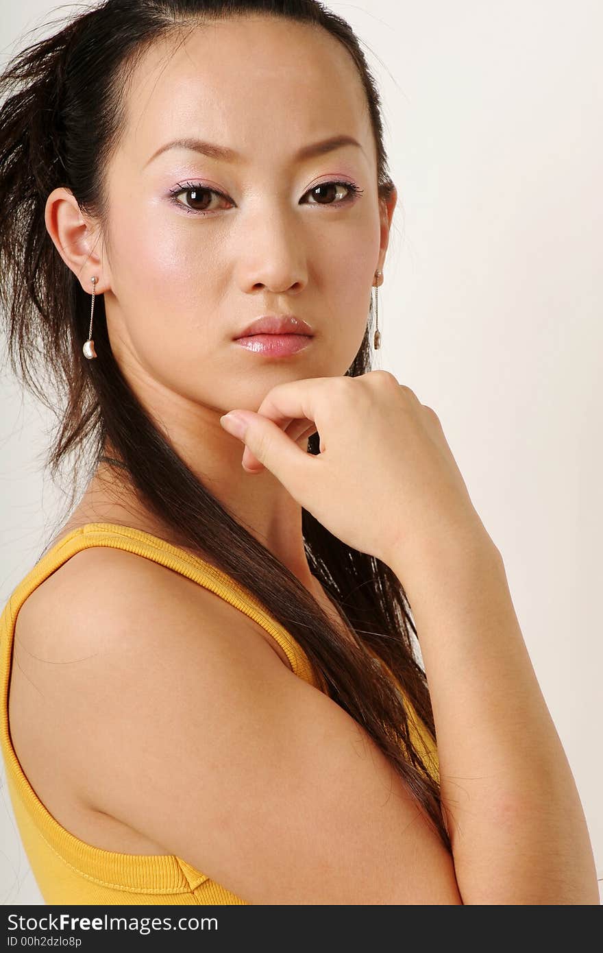 Beautiful Chinese girl in yellow gilet