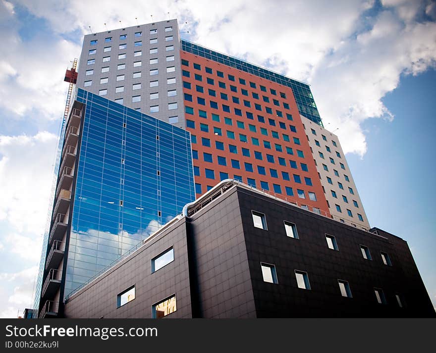 Office building under blue skies. Office building under blue skies.