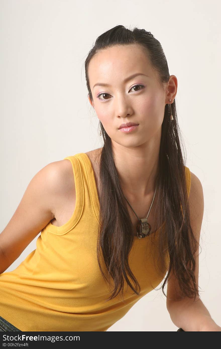 Beautiful Chinese girl in yellow gilet