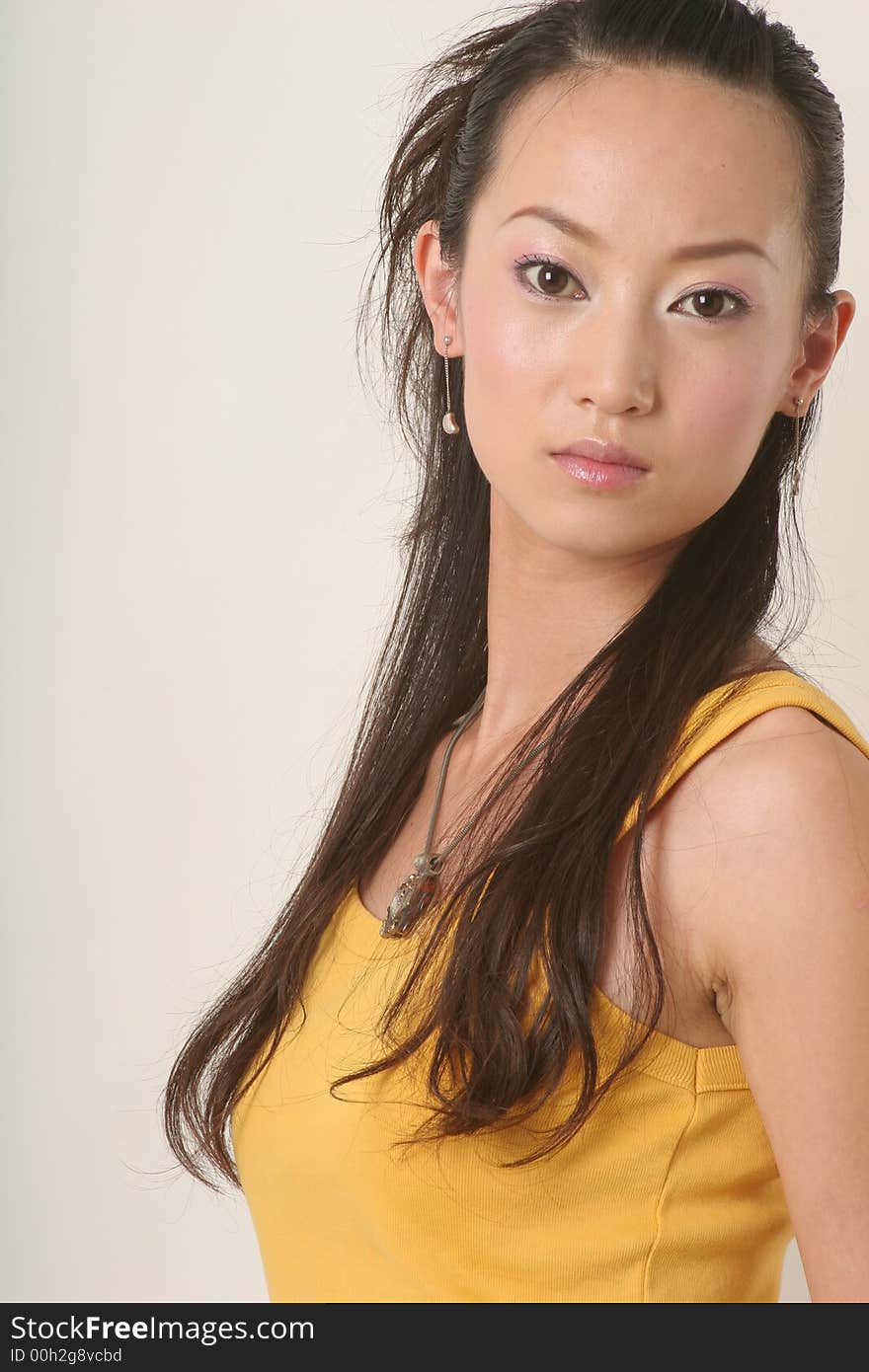 Beautiful Chinese girl in yellow gilet