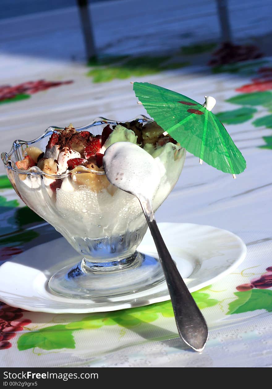 Beautiful ice-cream in glass with fruits and chocolate