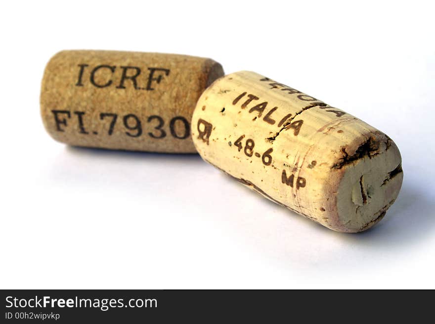 Two corks of good wine on white background. Two corks of good wine on white background