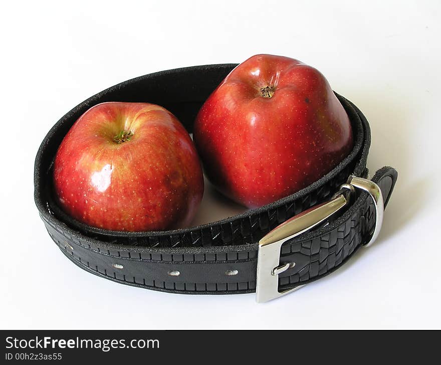 Two red apples in a belt. isolated. Two red apples in a belt. isolated