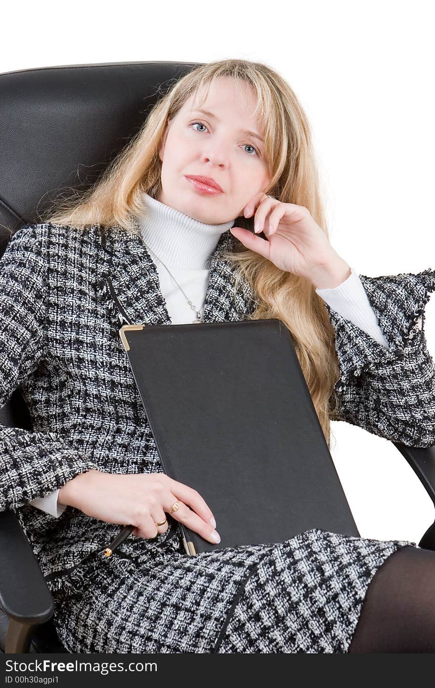 A business woman sitting in a black chair