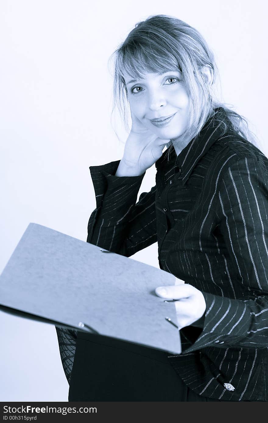 A smiling woman with a folder