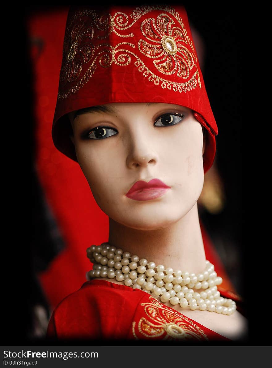 Mannequin with turkish hat, robes, and pearls