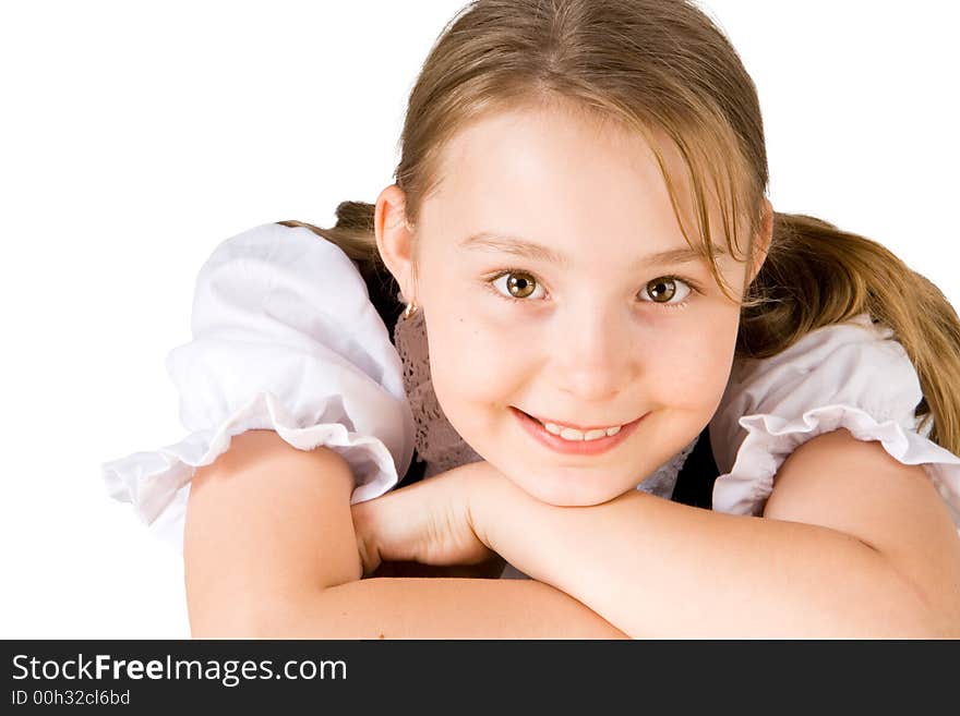 A smiling blond girl with brown eyes