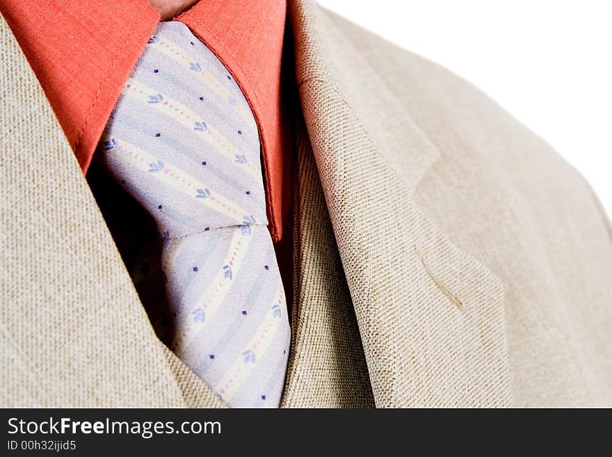 A close up of a suit and tie with a white background