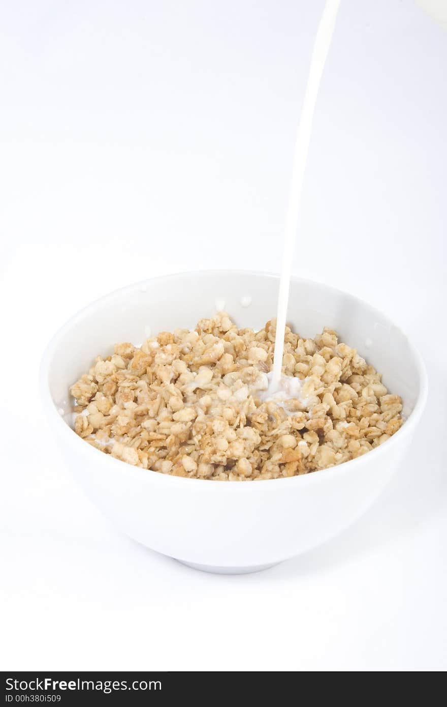 Photo of the cereals with the milk running on them