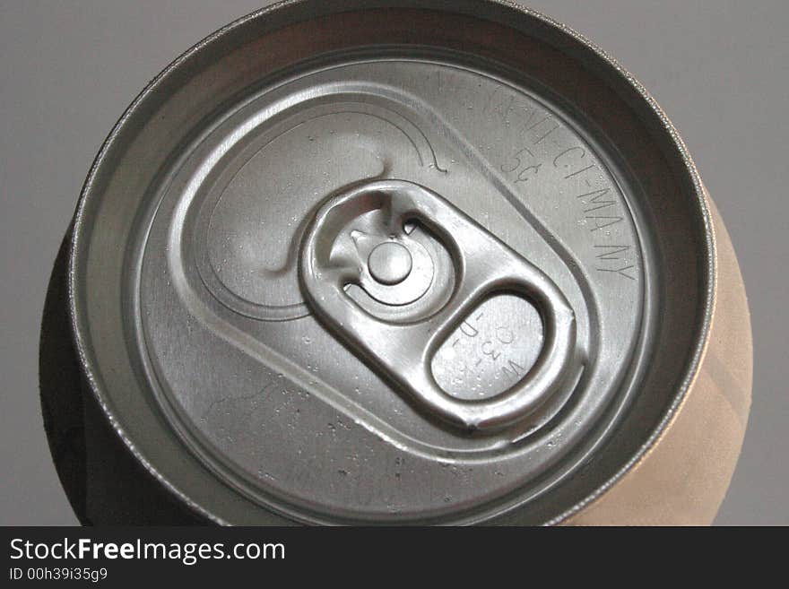 A soda pop can pull top with some condensation on an isolated background. A soda pop can pull top with some condensation on an isolated background