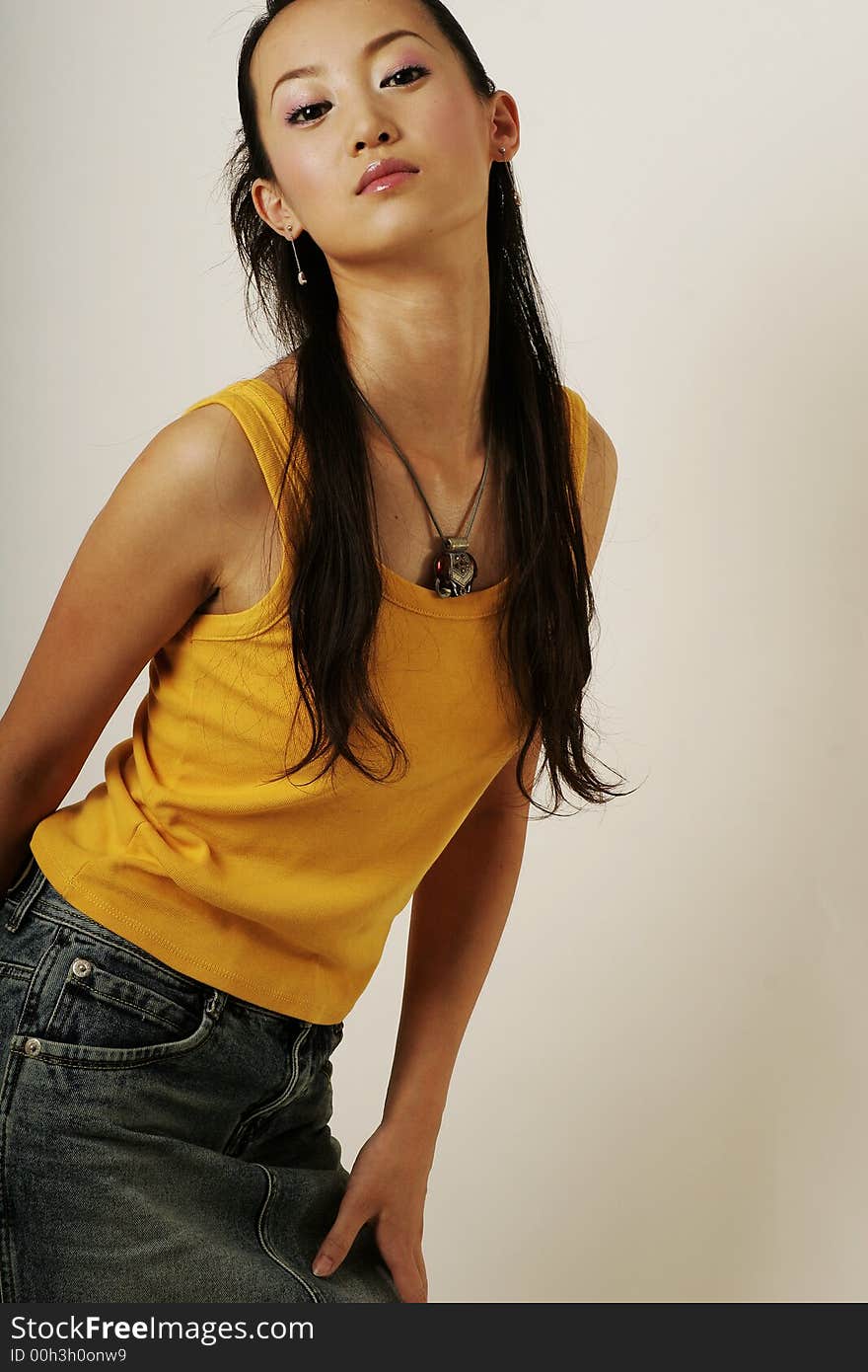 Beautiful Chinese girl in yellow gilet