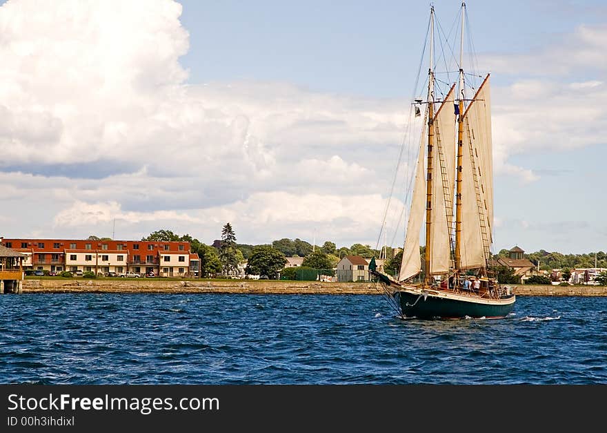 A view of a two masted sailboat or schooner approaching. A view of a two masted sailboat or schooner approaching.