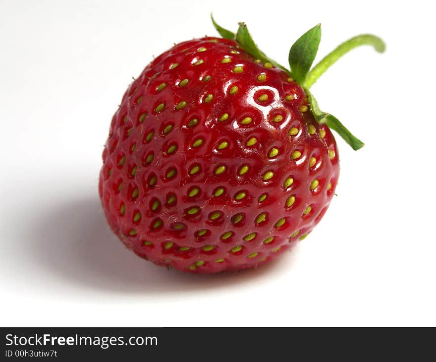 One strawberry on the white background