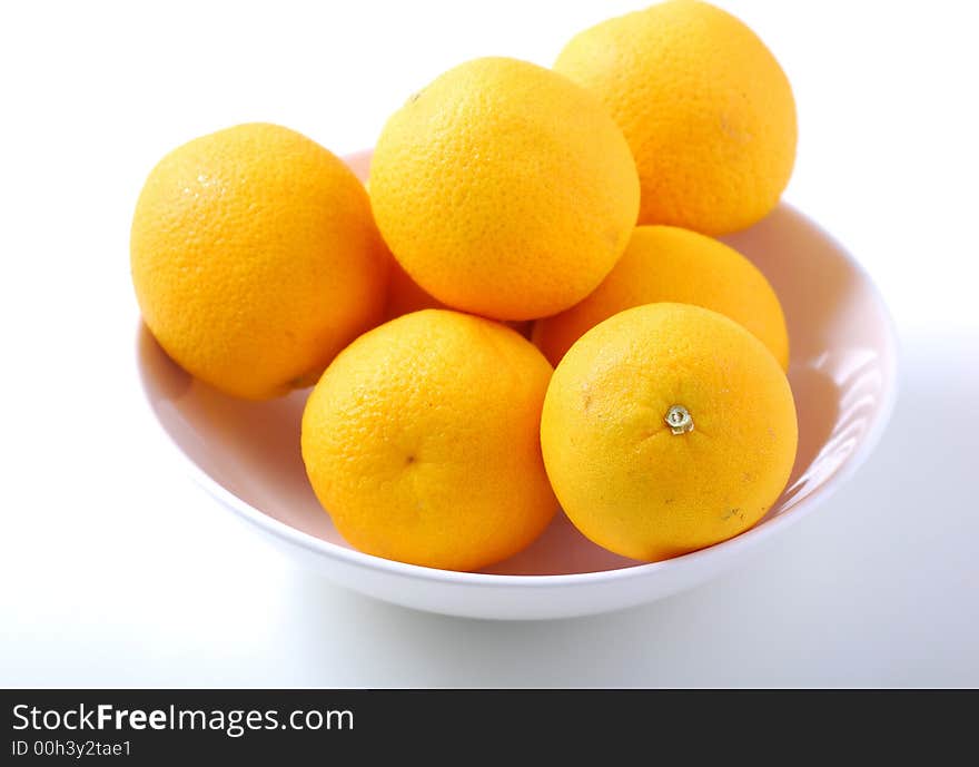 Orange fruits in white bowl. Orange fruits in white bowl