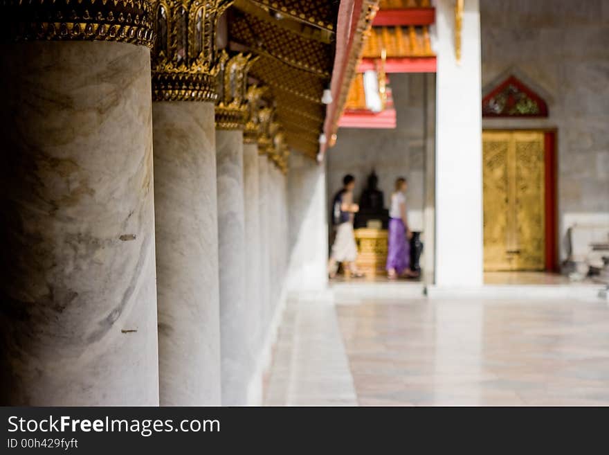 Tourists visiting a Thai Buddhist temple, Bangkok Thailand. Tourists visiting a Thai Buddhist temple, Bangkok Thailand