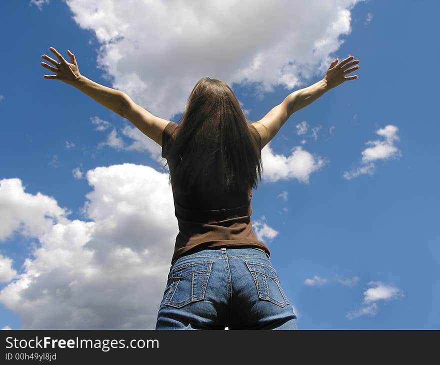 Life is beautiful .Young woman and clouds .