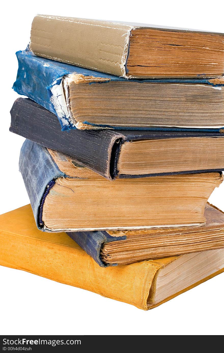 Old books lay a column on a white background