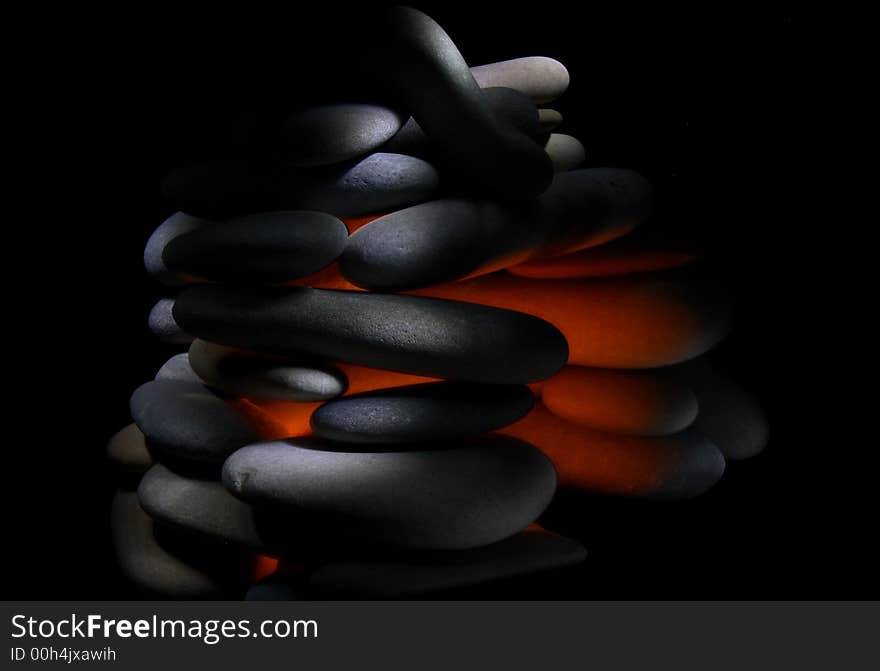 The hot stone isolated on black background