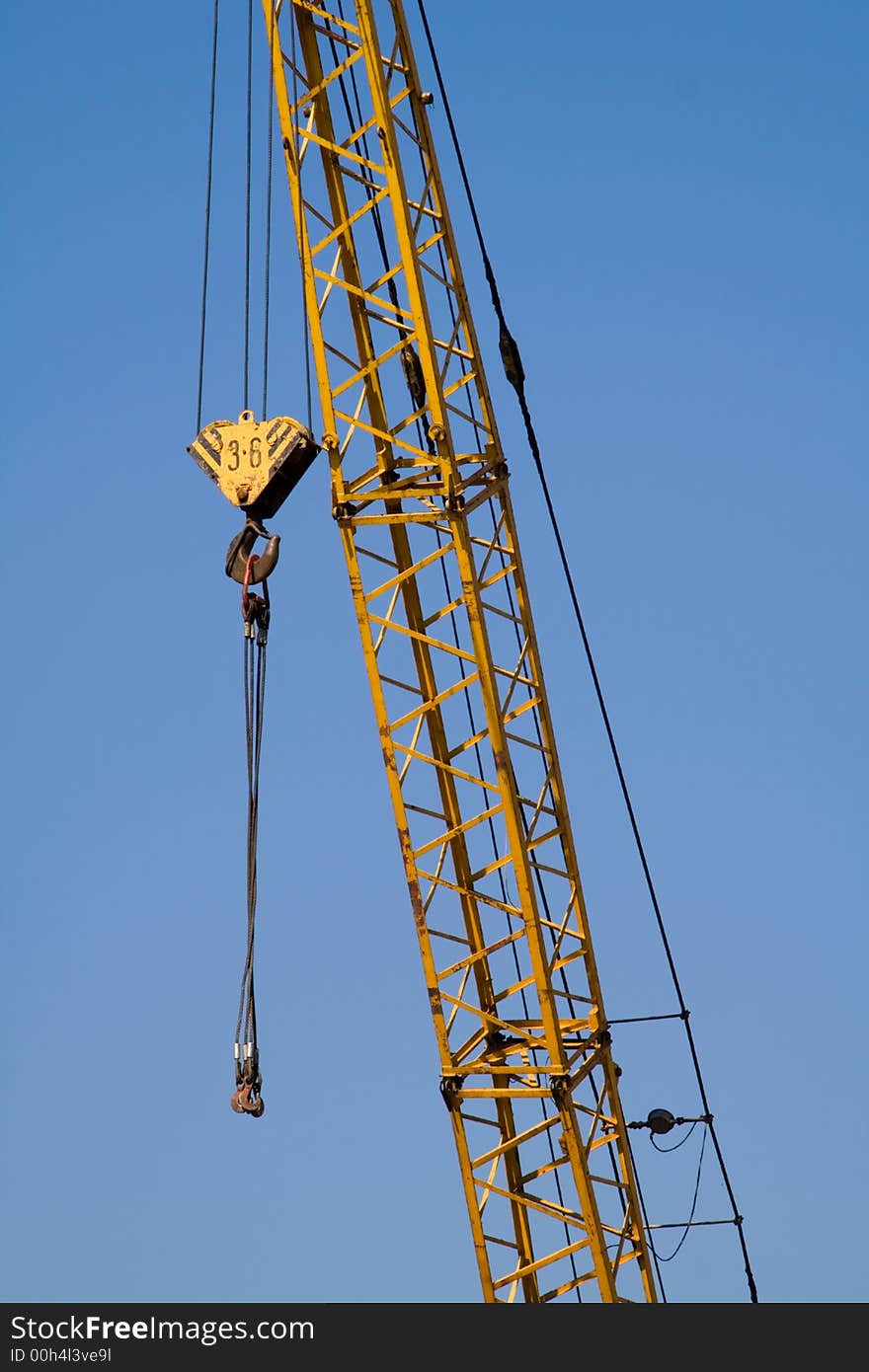 Crane against clear blue sky