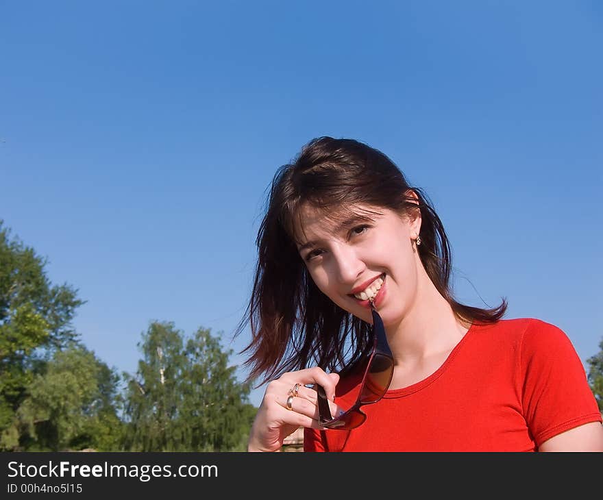 Portrait of the young attractive girl with an attractive smile and a happy look. Portrait of the young attractive girl with an attractive smile and a happy look.