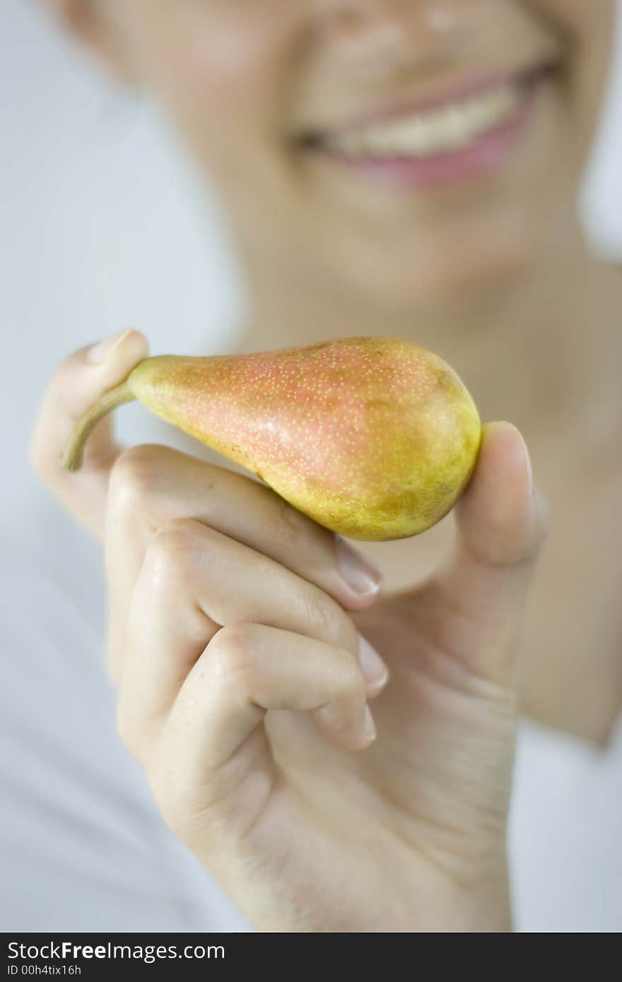 Girl holding pear