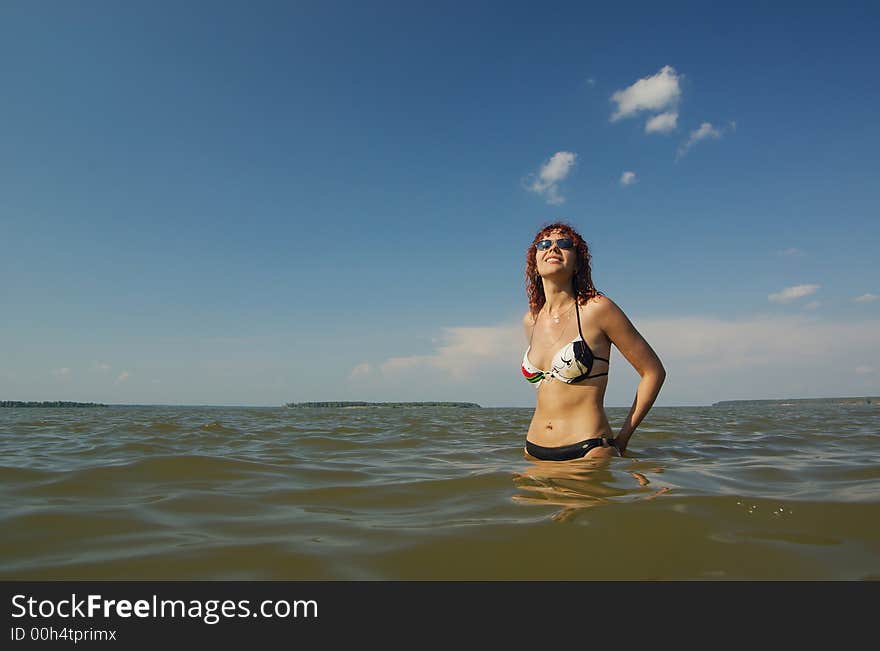 Girl stands in the sea