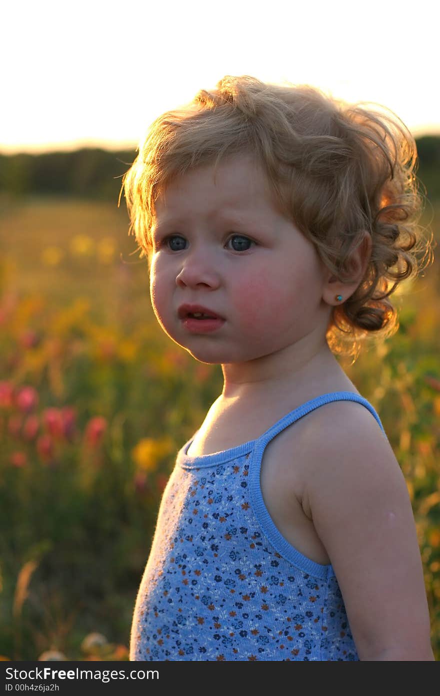 Summer girl on sunset background