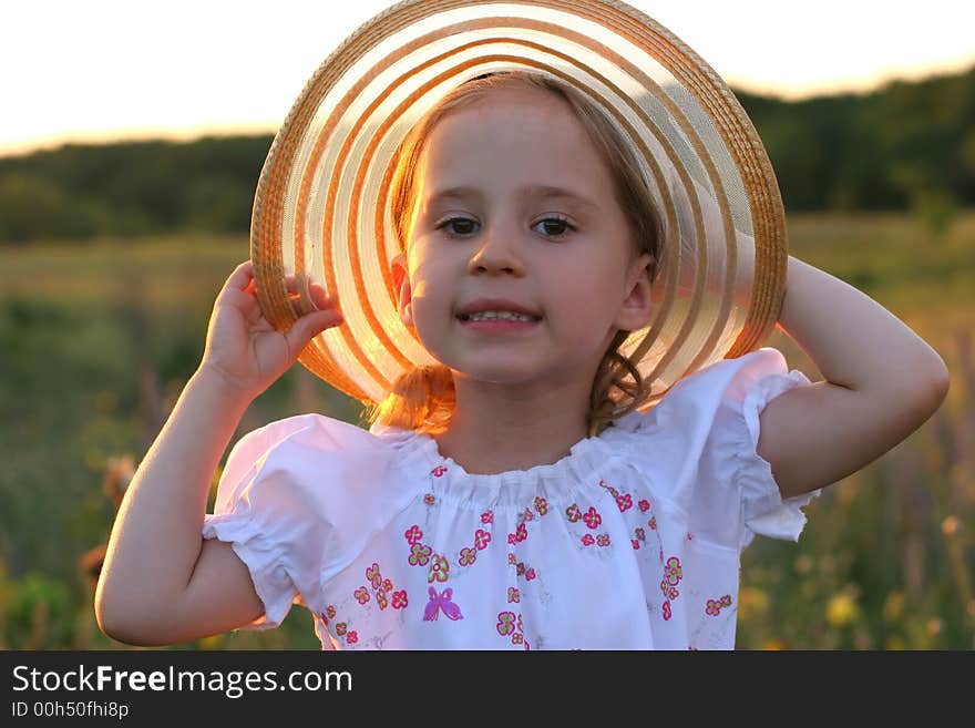 Summer girl on sunset background