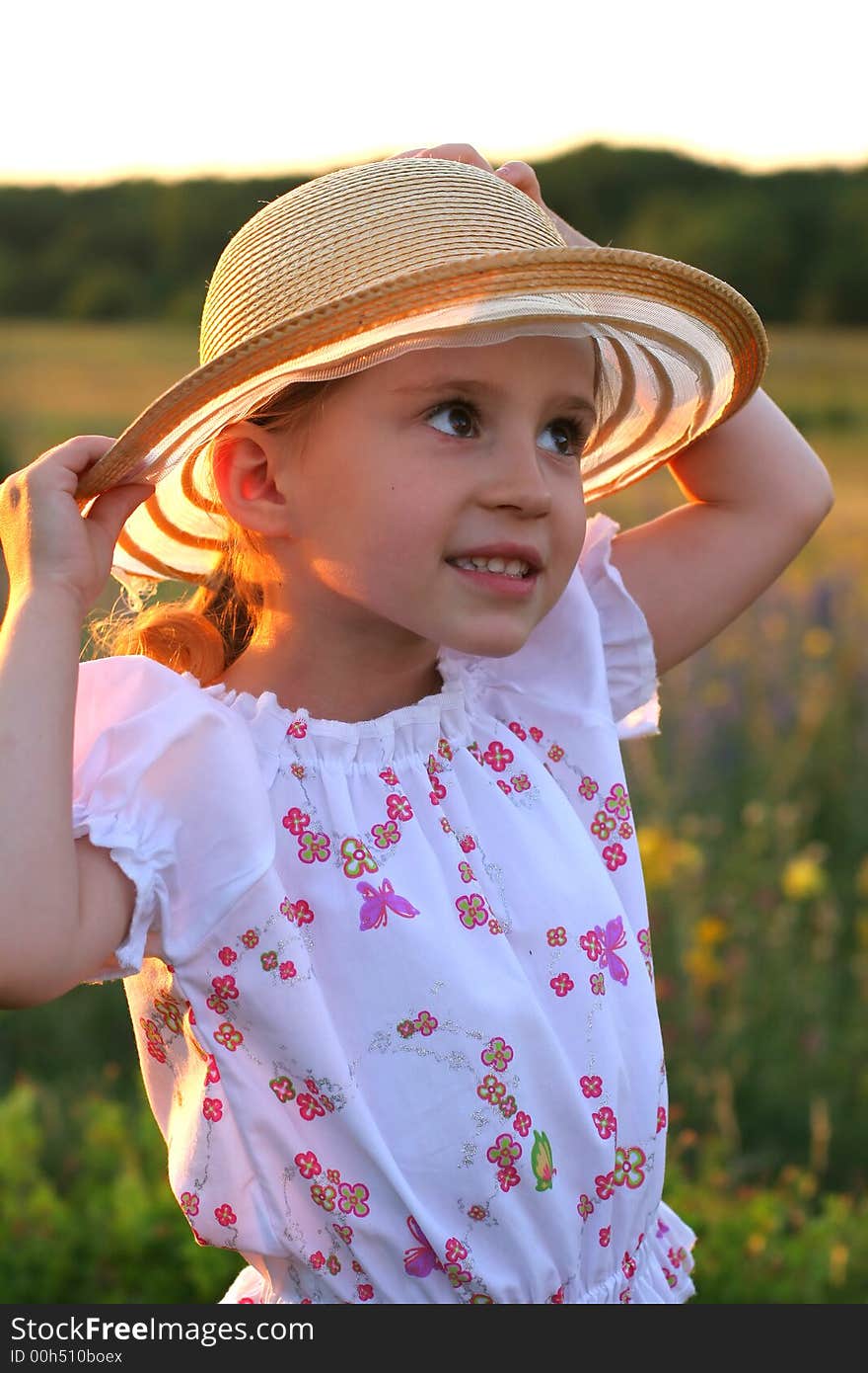 Summer girl on sunset background