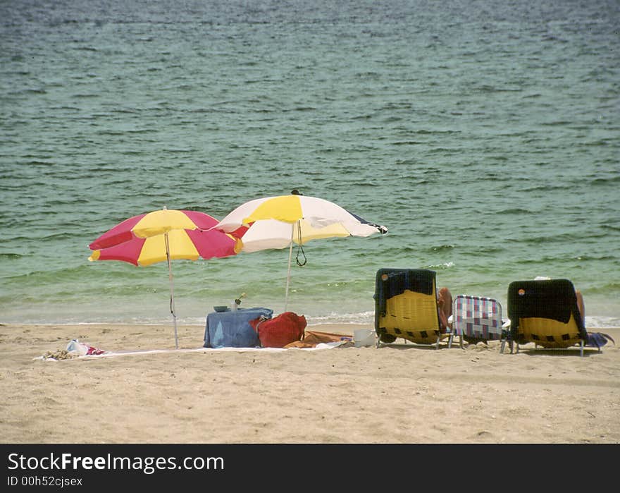 Florida beach scene with ocean and beach chairs