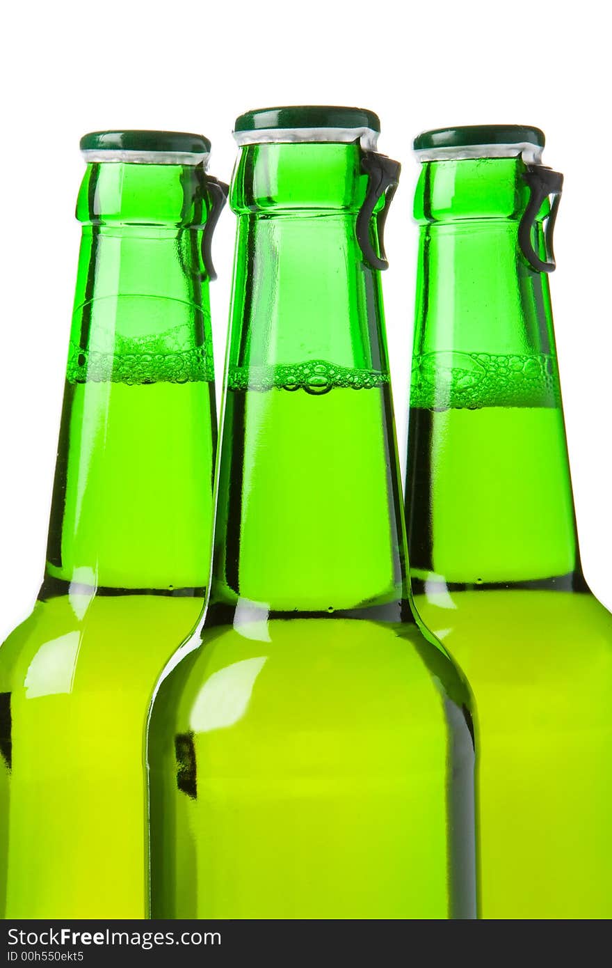 Three green beer bottles