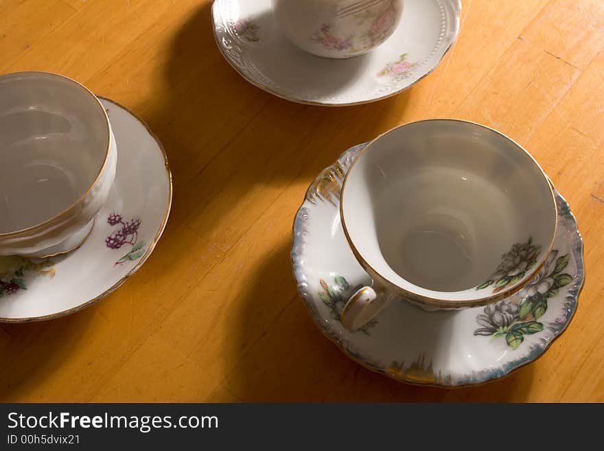 Three Teacups On Table.