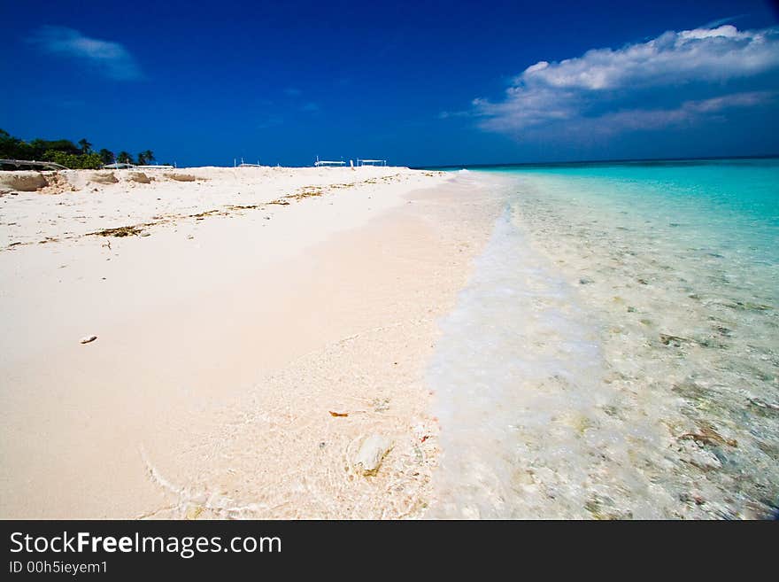 Ocean view of beautiful caribbean blue water beside a secluded white sand beach. Ocean view of beautiful caribbean blue water beside a secluded white sand beach