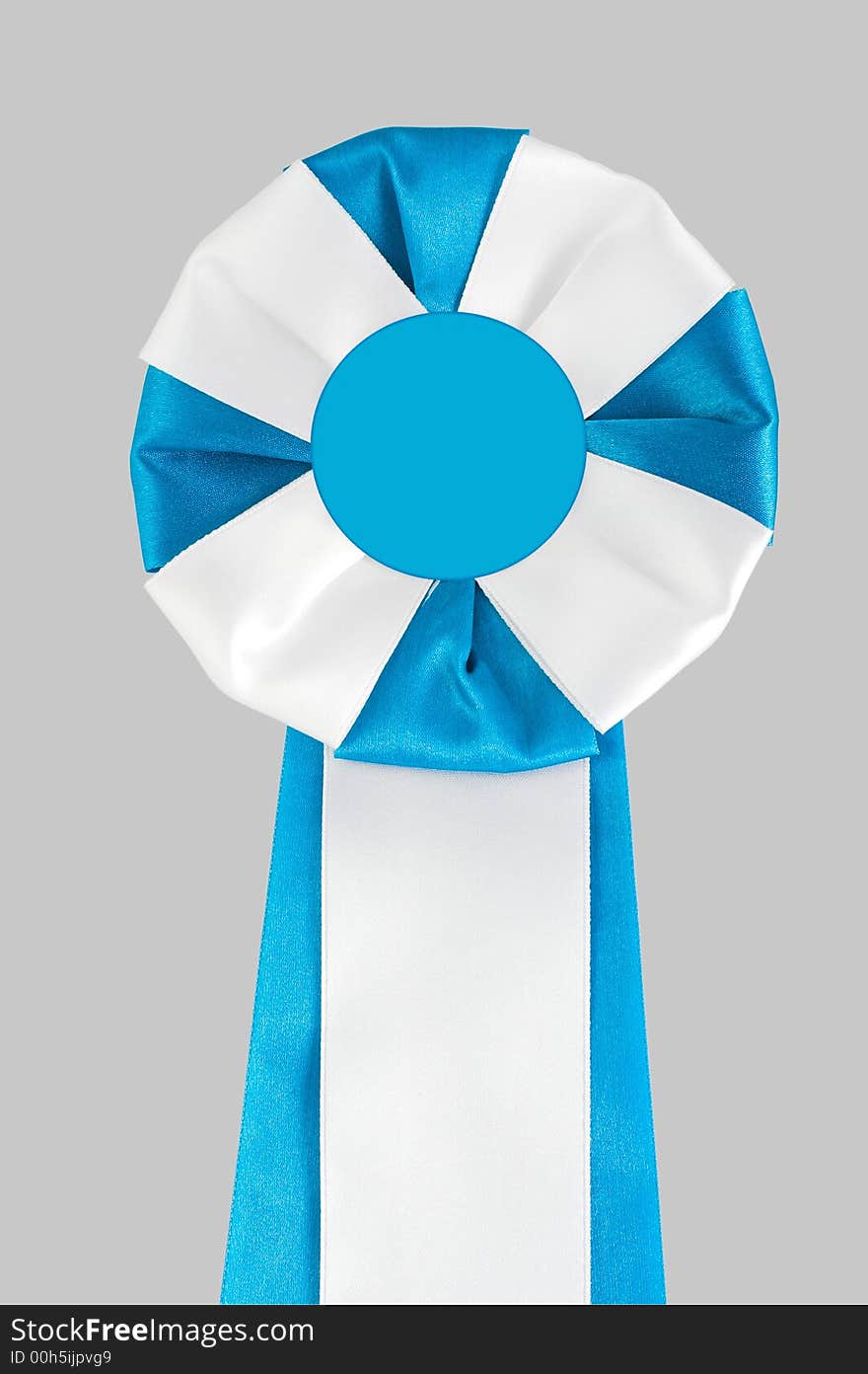 Close-up award rosette on the grey background. Image contains clipping path. Close-up award rosette on the grey background. Image contains clipping path.