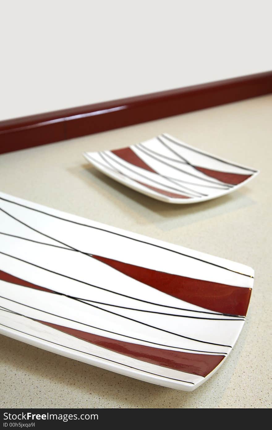 Two rectangular and modern plates on a table