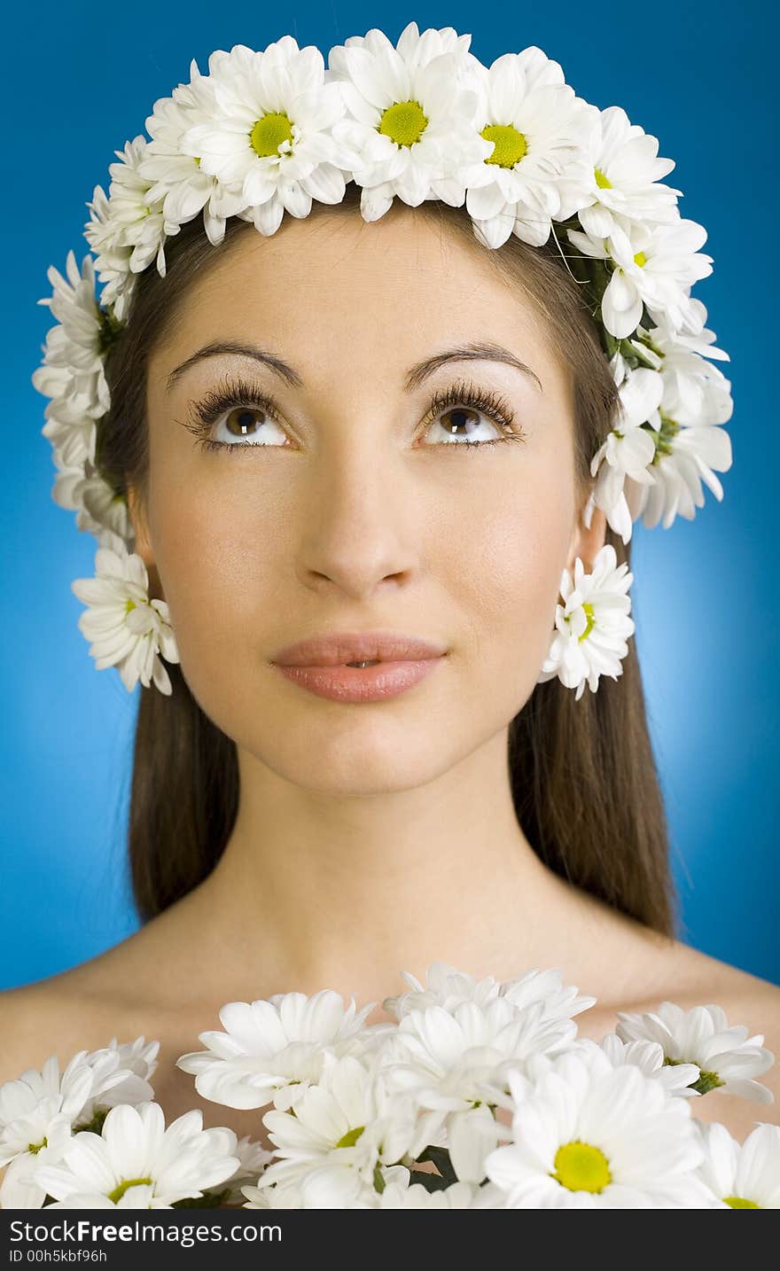 Young, beautiful and naked woman with bouquet of white flowers. White background, front view. Young, beautiful and naked woman with bouquet of white flowers. White background, front view