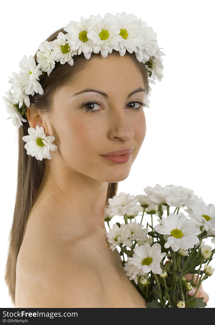 Young, beautiful and naked woman with bouquet of white flowers. White background, looking at camera. Side view. Young, beautiful and naked woman with bouquet of white flowers. White background, looking at camera. Side view