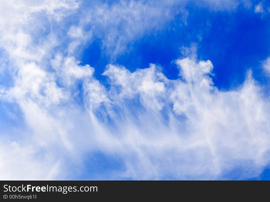 Flower-like clouds in the blue sky. Flower-like clouds in the blue sky