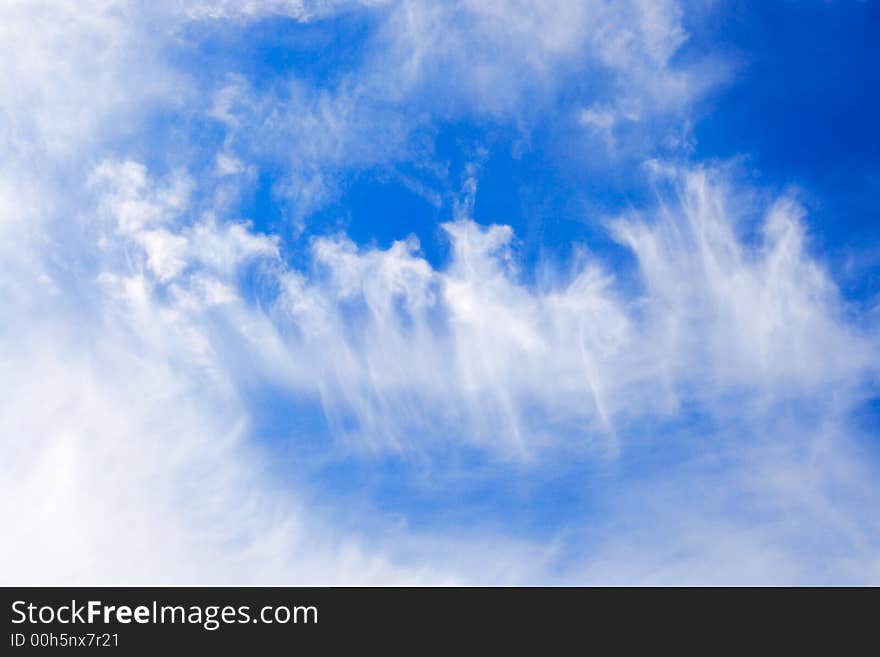 Flower-like clouds in the blue sky. Flower-like clouds in the blue sky