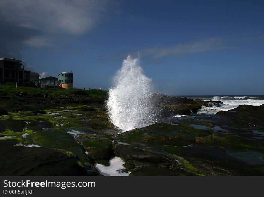 Pacific Ocean , a wave breaks against the Shore. Pacific Ocean , a wave breaks against the Shore