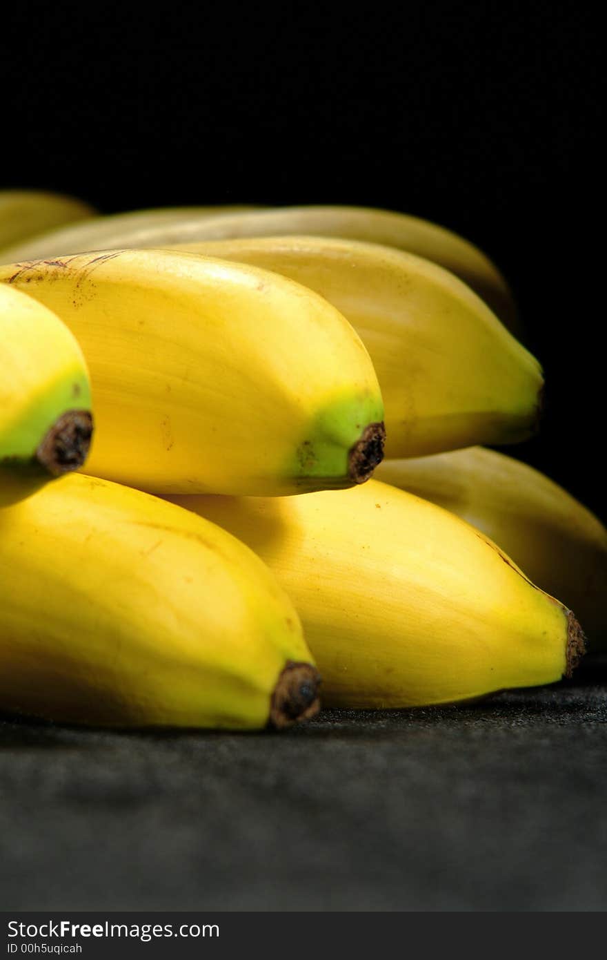 Bunch of bananas isolated on a black background. Bunch of bananas isolated on a black background