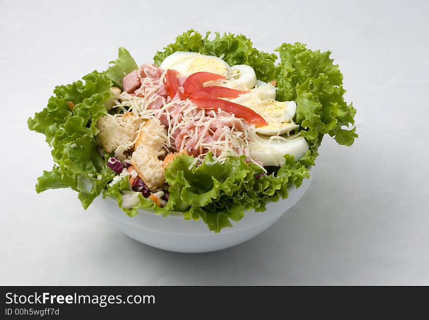 Salad with onion, olive, cheese, and other ingredients