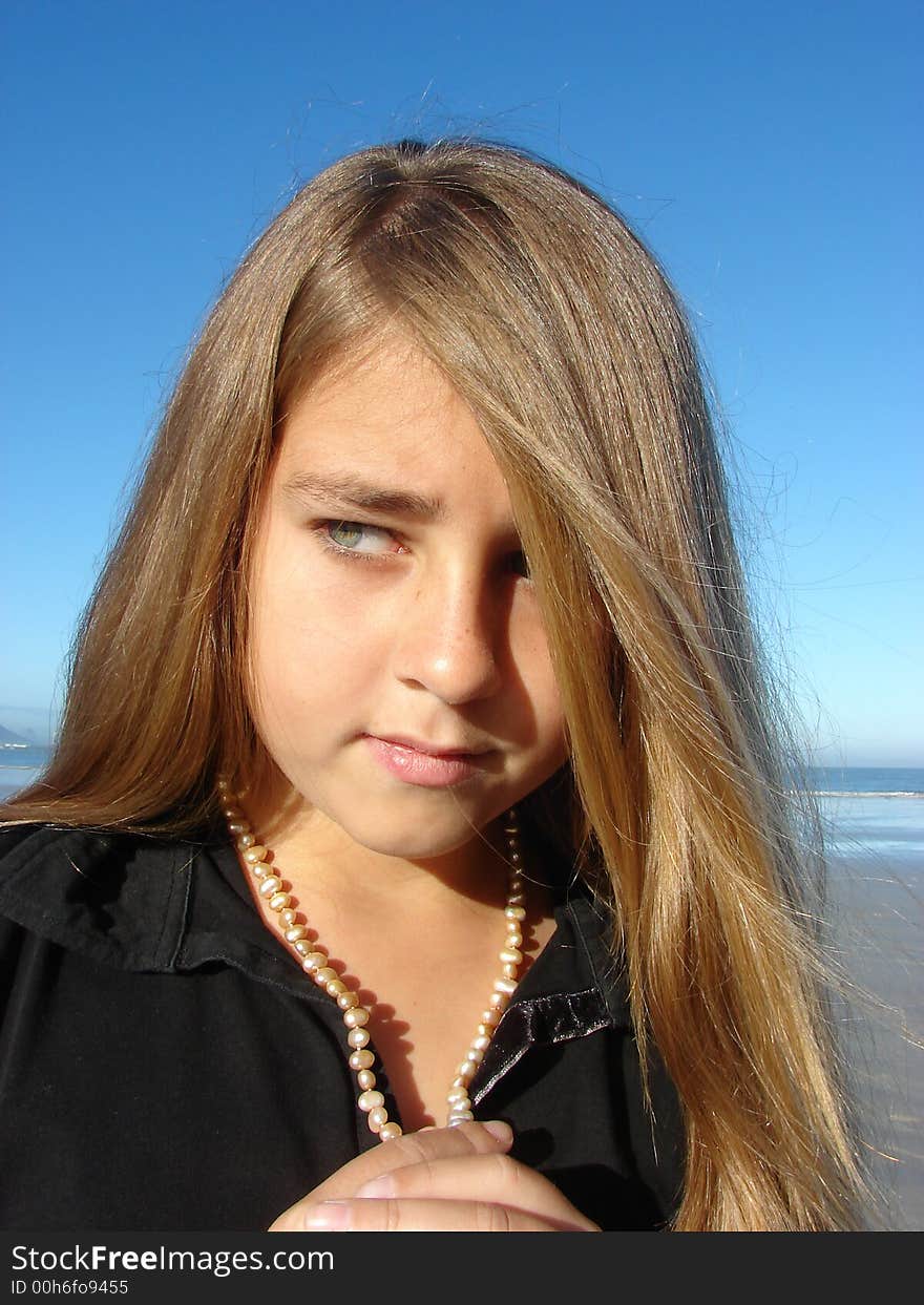 Young girl on the beach, Head & Shoulders shot with jewellery. Young girl on the beach, Head & Shoulders shot with jewellery