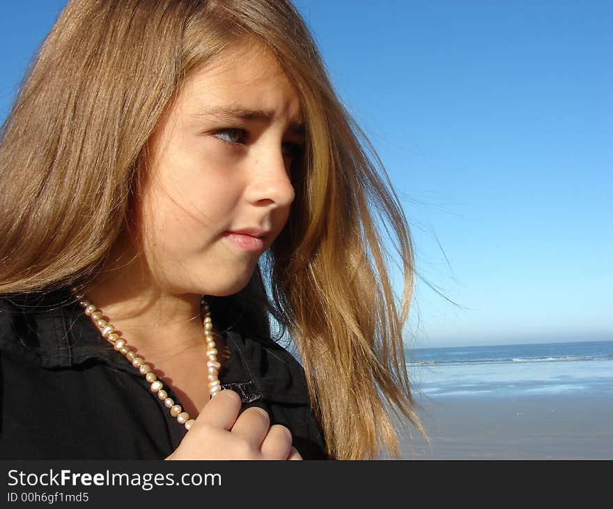 Young girl on the beach, Head & Shoulders shot with jewellery. Young girl on the beach, Head & Shoulders shot with jewellery