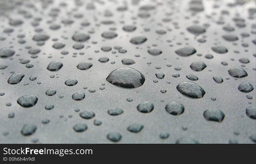 Rain drops on a body car