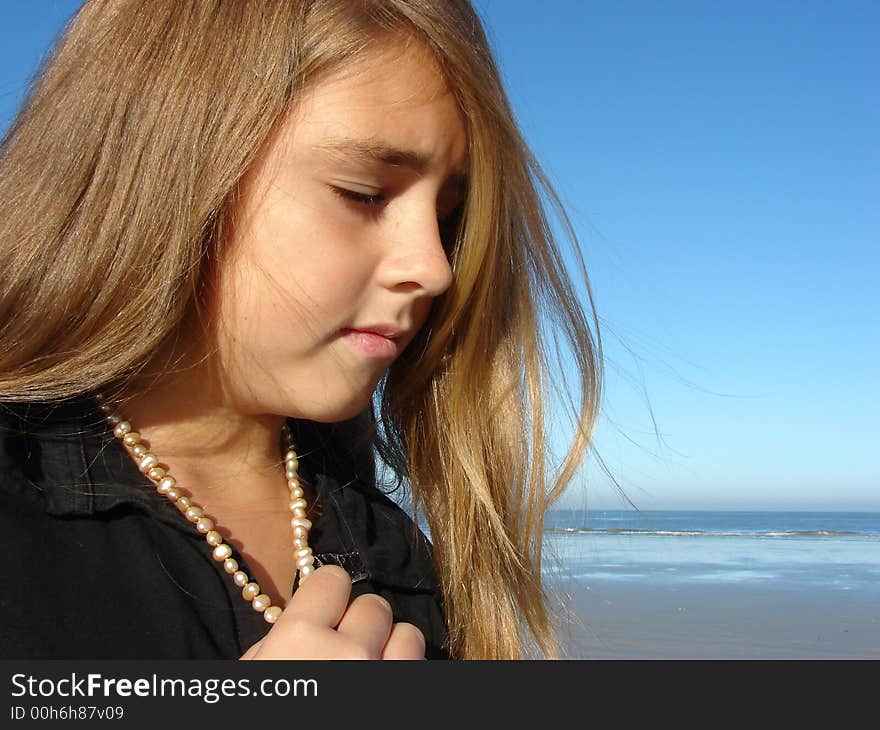 Young girl on the beach, Head & Shoulders shot with jewellery. Young girl on the beach, Head & Shoulders shot with jewellery