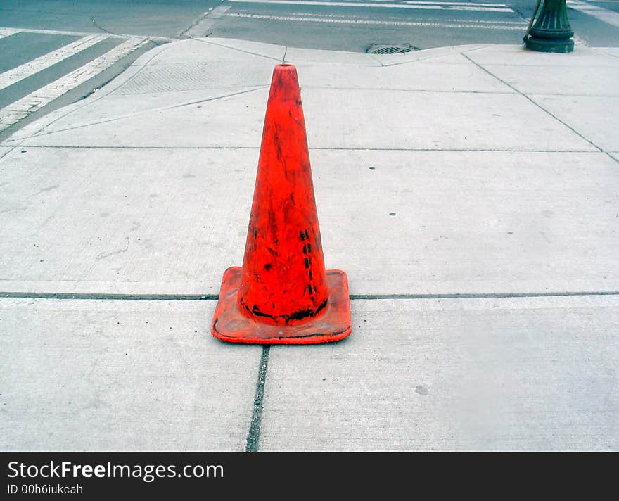 Orange traffic cone on Spokane sidewalk. Orange traffic cone on Spokane sidewalk.