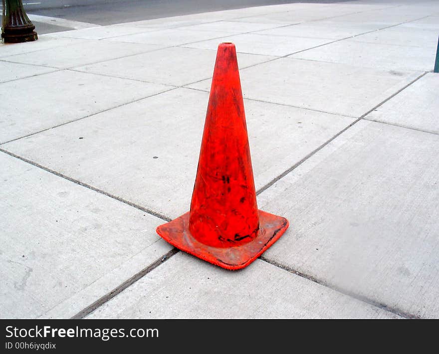 Orange traffic cone on Spokane sidewalk. Orange traffic cone on Spokane sidewalk.