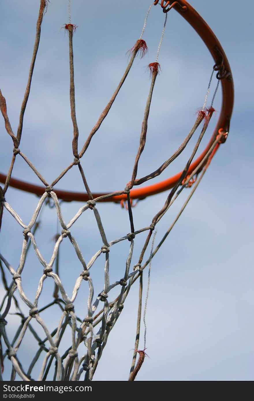 Basketball equipment - a hoop with a really old net.