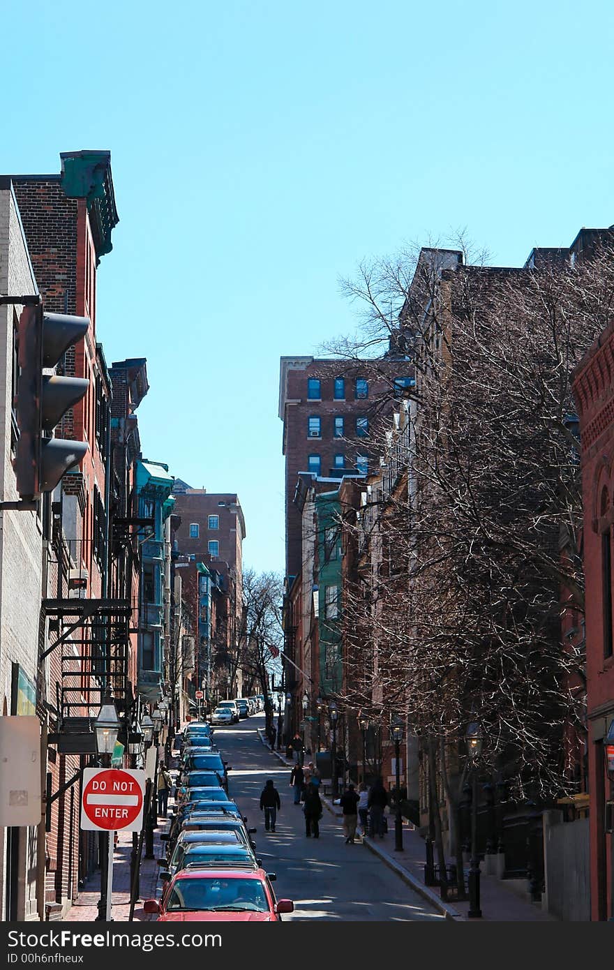 Looking up one of the many brownstone lined streets in boston's beacon hill district,. Looking up one of the many brownstone lined streets in boston's beacon hill district,